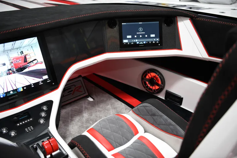 Slide: The Image of Interior of 2025 Daves Custom Boats M42R, featuring modern dashboard and luxury seating. - 13