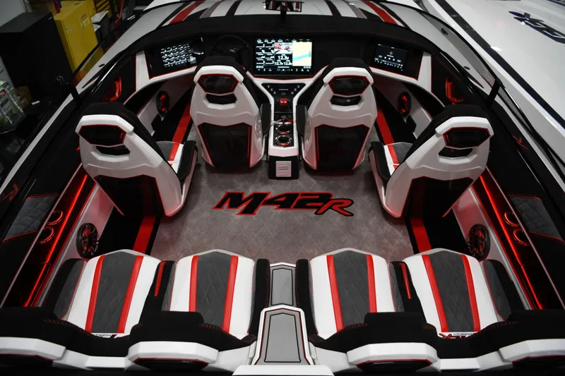 Slide: The Image of Interior of 2025 Daves Custom Boats M42R with sleek, modern design and red accents. - 14