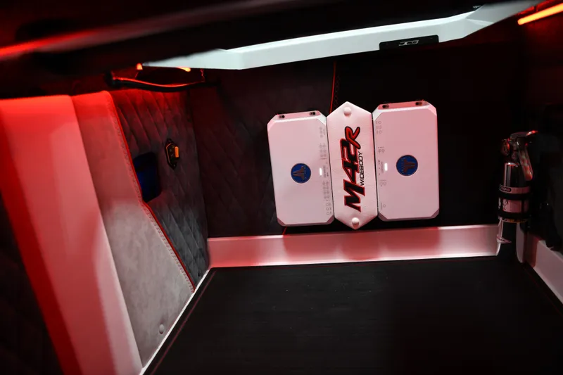 Slide: The Image of Interior of 2025 Daves Custom Boats M42R with modern design and red ambient lighting. - 15