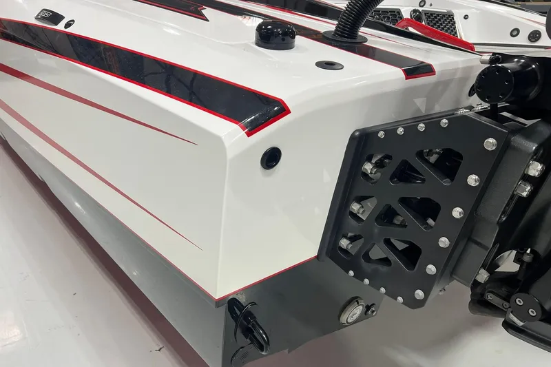 Slide: The Image of 2025 Daves Custom Boats M42R, sleek white and red design, detailed rear view. - 18