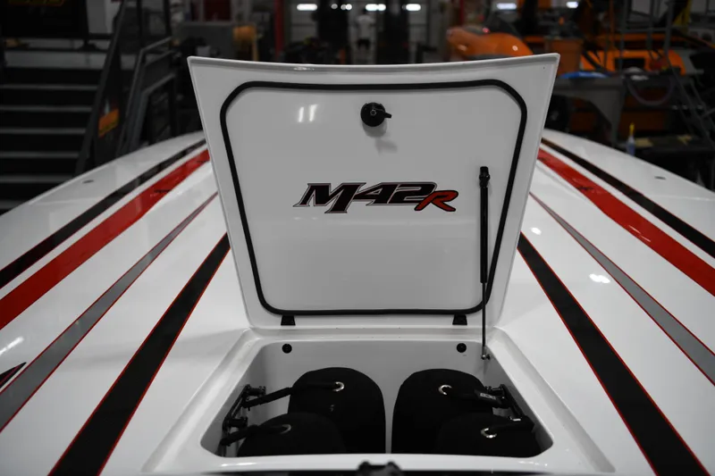 Slide: The Image of 2025 Daves Custom Boats M42R with open hatch, showcasing sleek red and black stripes. - 20
