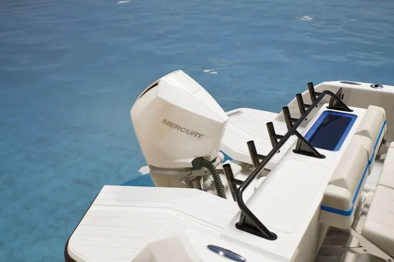 Slide: The Image of 2026 Wellcraft 28 T-Top boat with Mercury engine on clear blue water. - 12