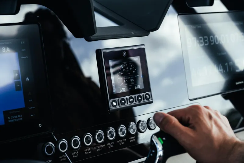 Slide: The Image of Dashboard of 2026 Wellcraft 28 T-Top boat with digital controls and displays. - 18