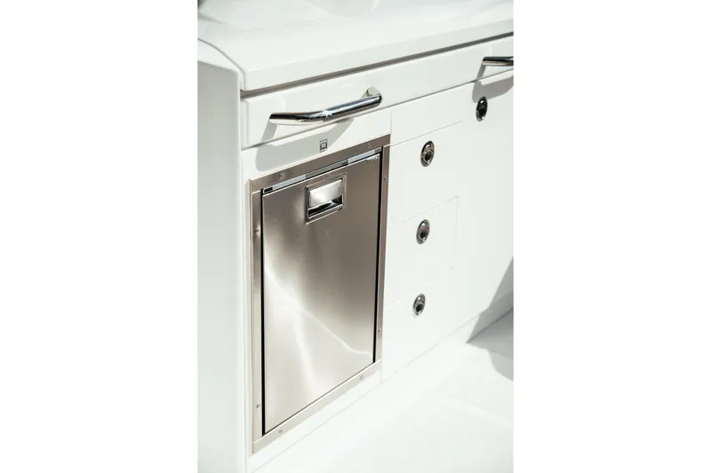 Slide: The Image of Stainless steel storage compartment on 2026 Wellcraft 28 T-Top boat interior. - 20