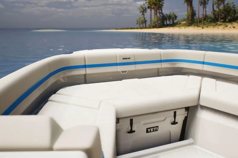 Slide: The Image of 2026 Wellcraft 28 T-Top boat interior with Yeti cooler, near tropical beach. - 3