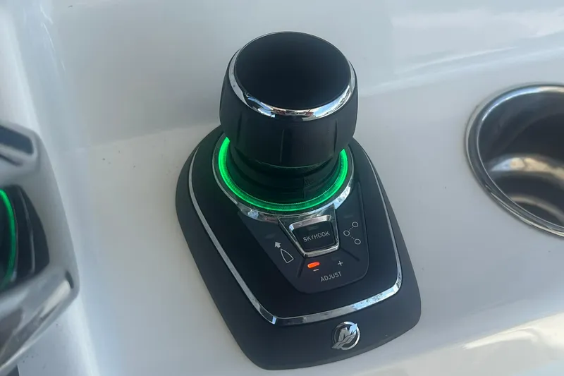 Slide: The Image of Joystick control on 2024 World Cat 325 CC boat, featuring illuminated buttons. - 14