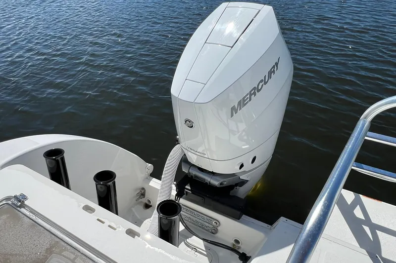 Slide: The Image of 2024 World Cat 325 CC boat with Mercury outboard engine on water. - 7