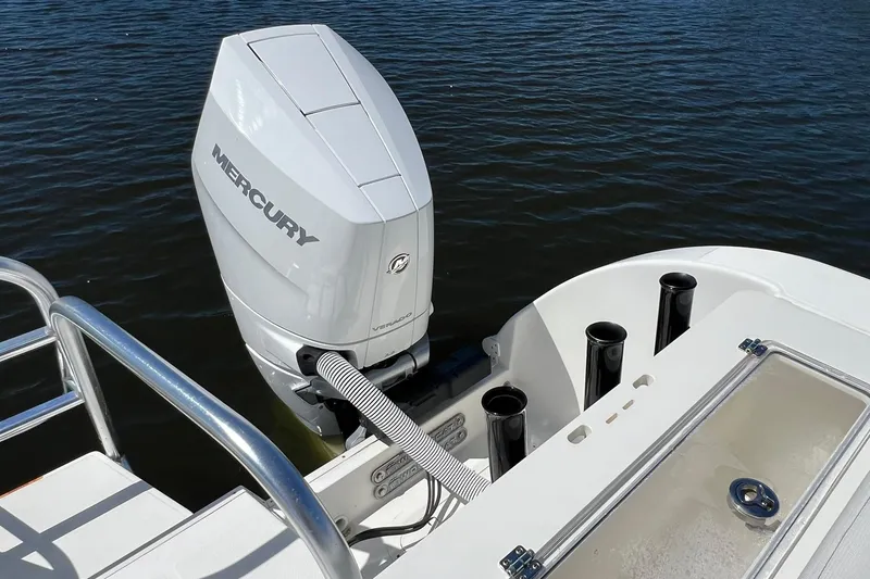 Slide: The Image of 2024 World Cat 325 CC boat with Mercury outboard engine on water. - 8