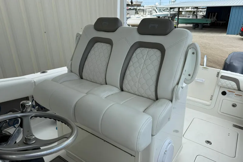 Slide: The Image of 2020 World Cat 280 CC-X boat with luxurious dual captain's seats and steering wheel. - 11