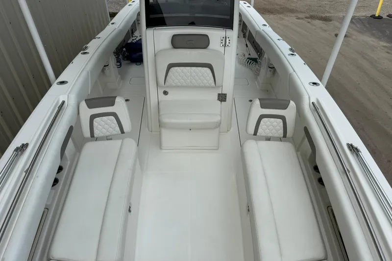 Slide: The Image of 2020 World Cat 280 CC-X boat interior with white seating and modern design. - 12