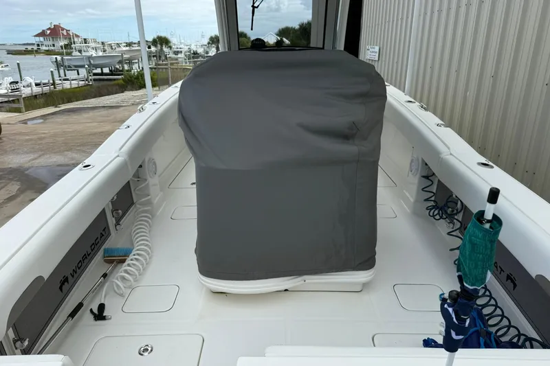 Slide: The Image of 2020 World Cat 280 CC-X boat interior with covered console, docked at marina. - 5