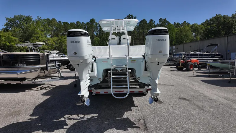 Slide: The Image of 2026 Twin Vee 280 GFX2 CC boat with dual 300 horsepower engines, parked outdoors. - 10