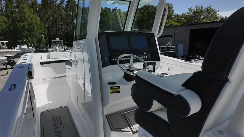 Slide: The Image of 2026 Twin Vee 280 GFX2 CC boat interior with modern helm and seating. - 13