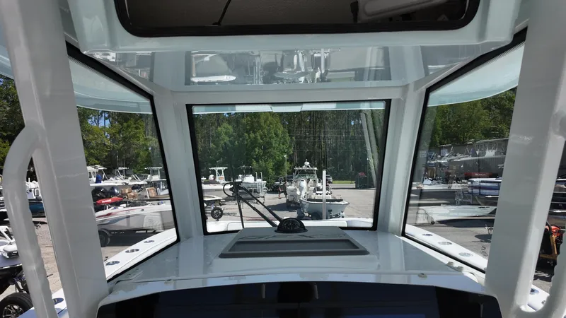 Slide: The Image of Interior view of 2026 Twin Vee 280 GFX2 CC boat, showcasing windshield and dashboard. - 15