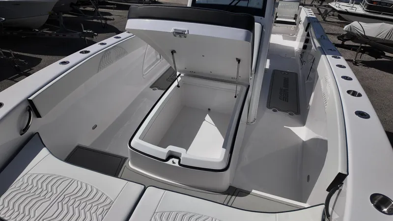 Slide: The Image of 2026 Twin Vee 280 GFX2 CC boat interior with open storage compartment. - 21