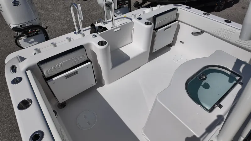 Slide: The Image of 2026 Twin Vee 280 GFX2 CC boat interior with seating and storage compartments. - 23