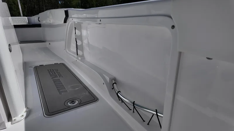 Slide: The Image of 2026 Twin Vee 280 GFX2 CC boat interior, showcasing sleek design and storage features. - 27