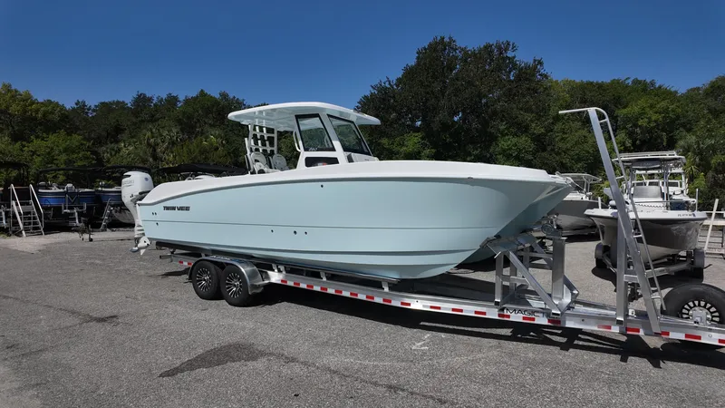 Slide: The Image of 2026 Twin Vee 280 GFX2 CC boat on trailer, parked outdoors. - 4