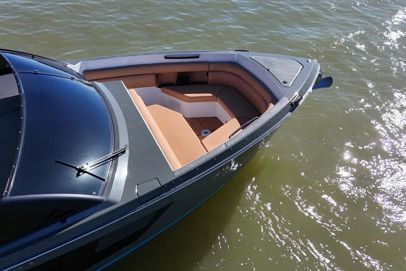Slide: The Image of 2022 Aviara AV40 OB boat with sleek design and spacious seating on water. - 10