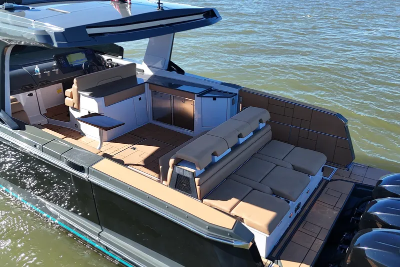 Slide: The Image of 2022 Aviara AV40 OB luxury boat with spacious seating and modern design on the water. - 12