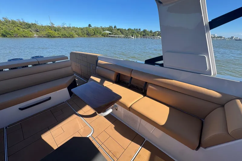 Slide: The Image of Luxurious seating area on 2022 Aviara AV40 OB boat, with scenic water view. - 14