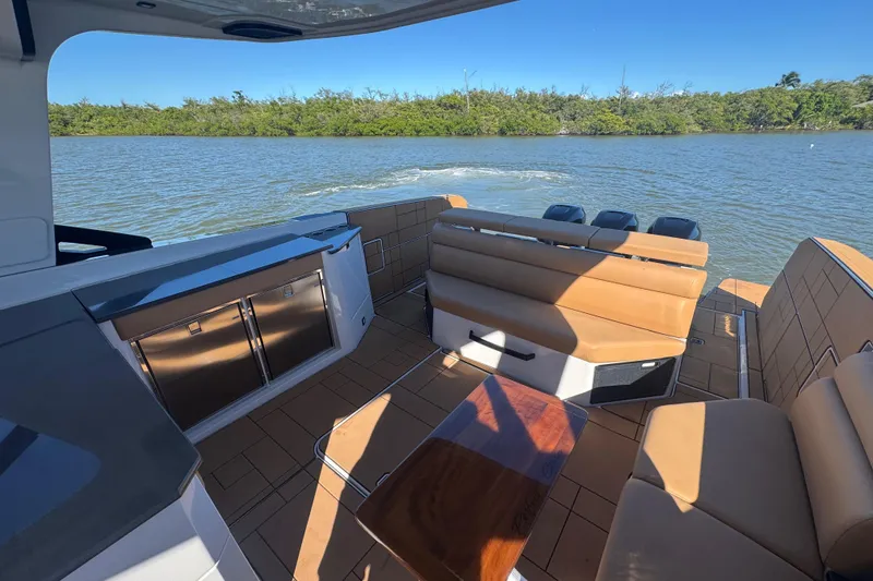 Slide: The Image of 2022 Aviara AV40 OB boat interior with luxurious seating and scenic water view. - 15