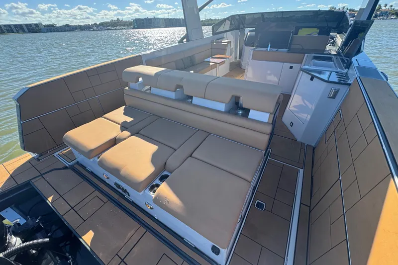 Slide: The Image of 2022 Aviara AV40 OB luxury boat interior with tan seating and modern amenities. - 19