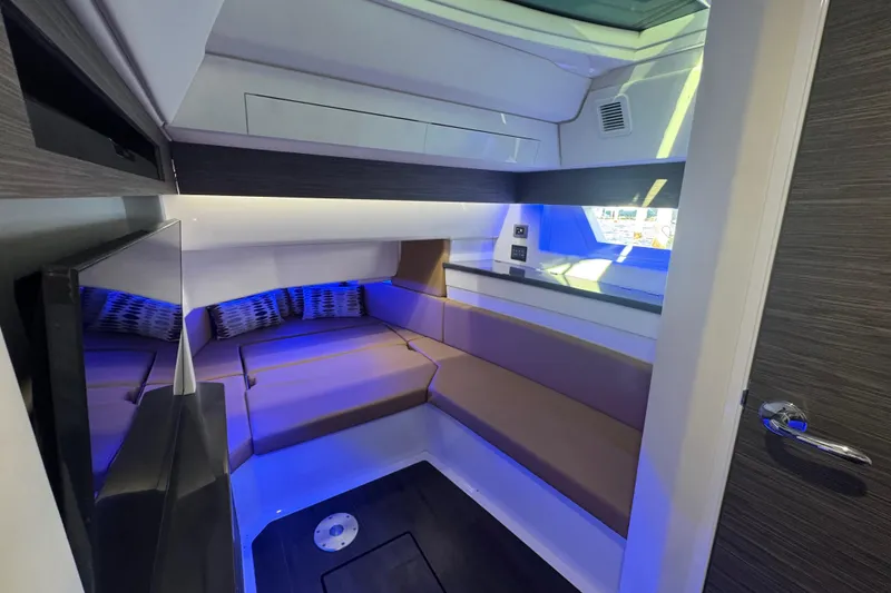 Slide: The Image of Luxurious interior cabin of 2022 Aviara AV40 OB boat with modern seating and ambient lighting. - 21