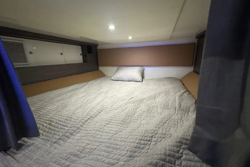 Slide: The Image of 2022 Aviara AV40 OB cabin interior with cozy bed and modern design. - 24