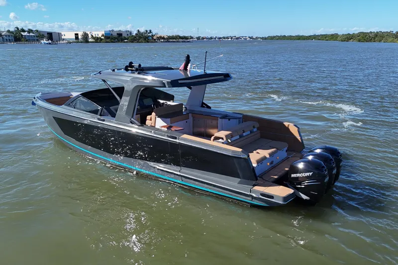 Slide: The Image of 2022 Aviara AV40 OB luxury boat cruising on a sunny day. - 6