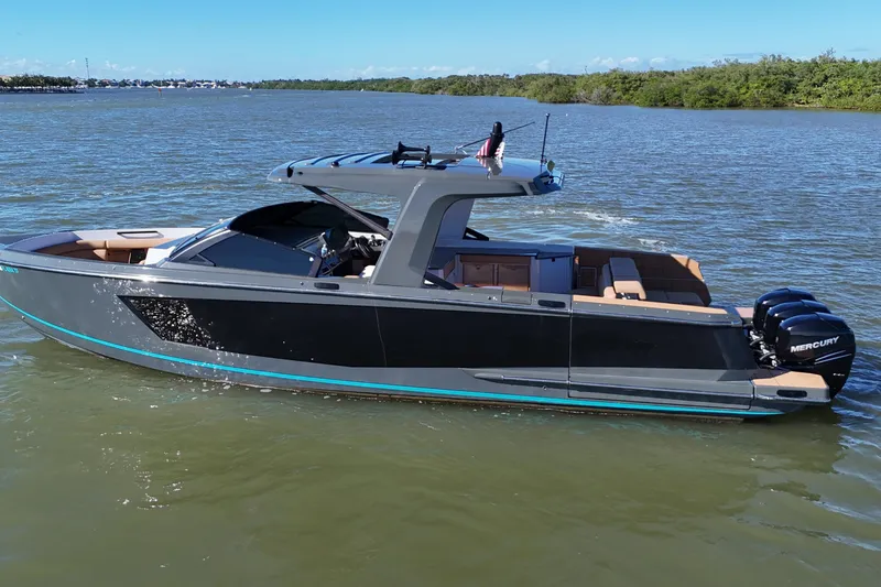Slide: The Image of 2022 Aviara AV40 OB luxury boat cruising on a calm river. - 7