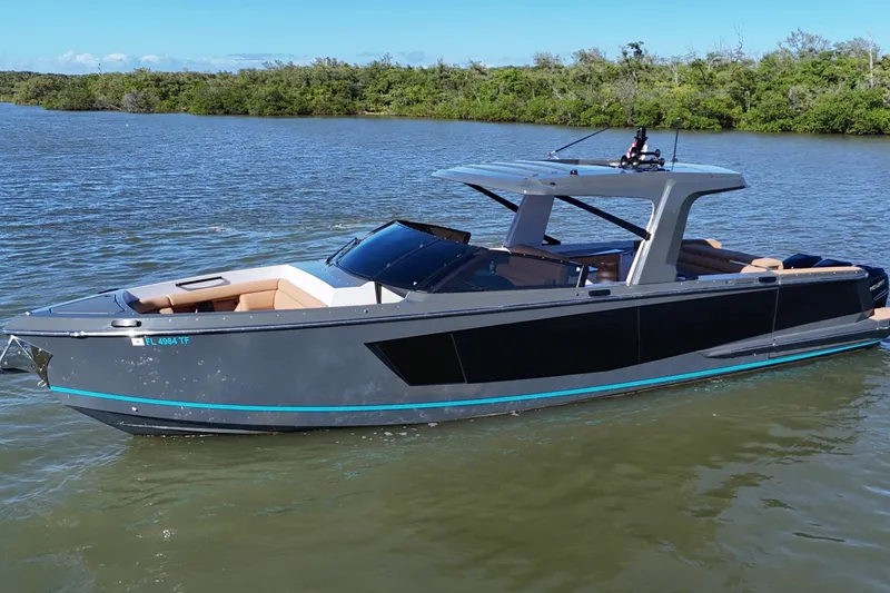 Slide: The Image of 2022 Aviara AV40 OB luxury boat on calm water, featuring sleek design and modern amenities. - 8