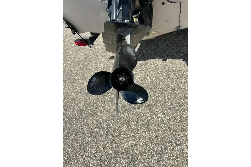 Slide: The Image of Propeller of 2000 SMOKERCRAFT 161 Pro Mag boat on asphalt surface. - 15