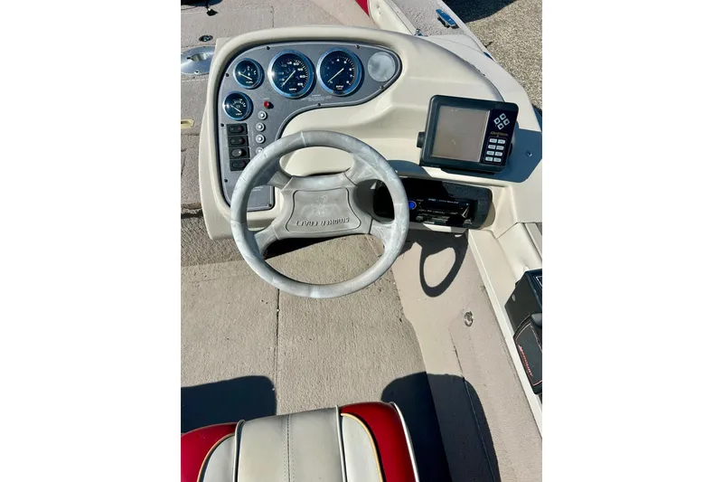 Slide: The Image of 2000 SMOKERCRAFT 161 Pro Mag boat dashboard with steering wheel and gauges. - 16