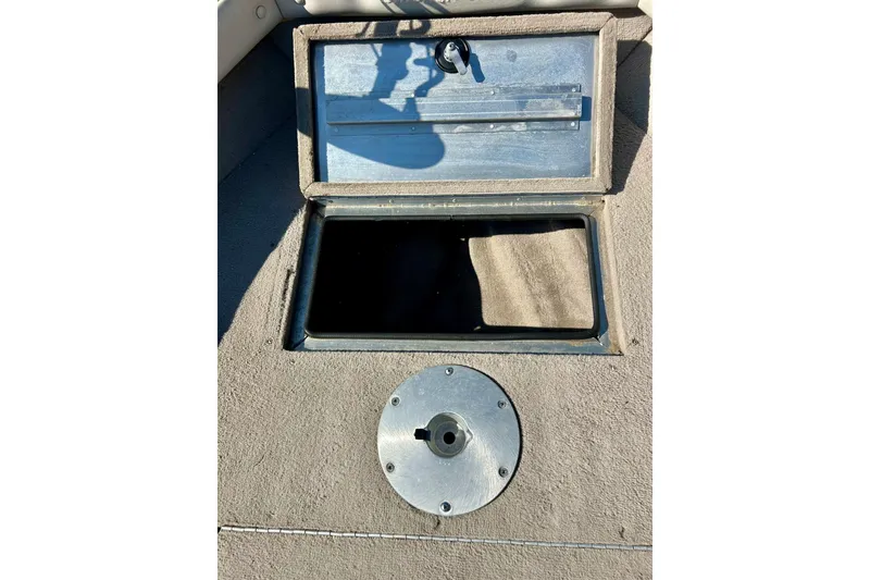 Slide: The Image of Open storage compartment on 2000 SMOKERCRAFT 161 Pro Mag boat deck. - 18