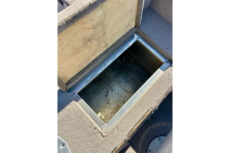 Slide: The Image of Open storage compartment in 2000 SMOKERCRAFT 161 Pro Mag boat. - 27