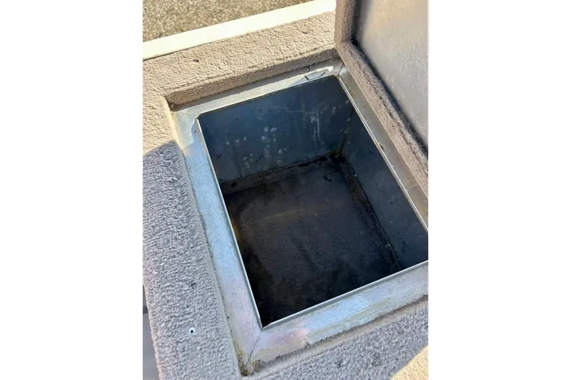 Slide: The Image of Open storage compartment on 2000 SMOKERCRAFT 161 Pro Mag boat. - 29