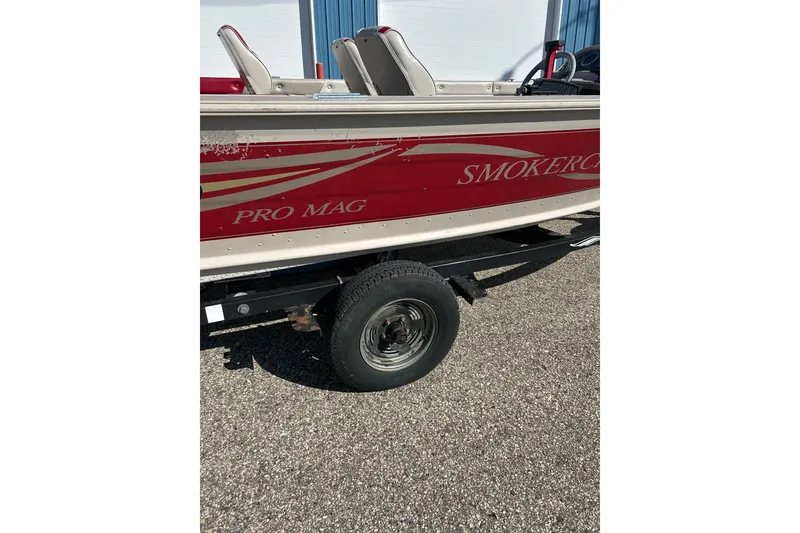 Slide: The Image of 2000 SMOKERCRAFT 161 Pro Mag boat on trailer, red and white design. - 3