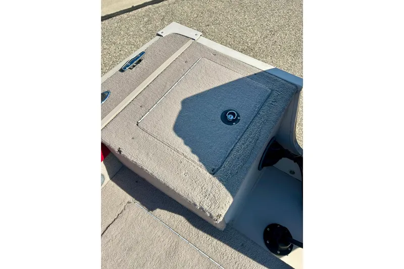 Slide: The Image of 2000 SMOKERCRAFT 161 Pro Mag boat interior with carpeted storage compartment. - 30