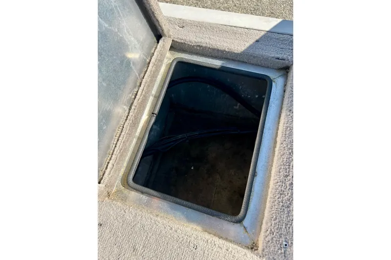 Slide: The Image of Open storage compartment on 2000 SMOKERCRAFT 161 Pro Mag boat. - 31