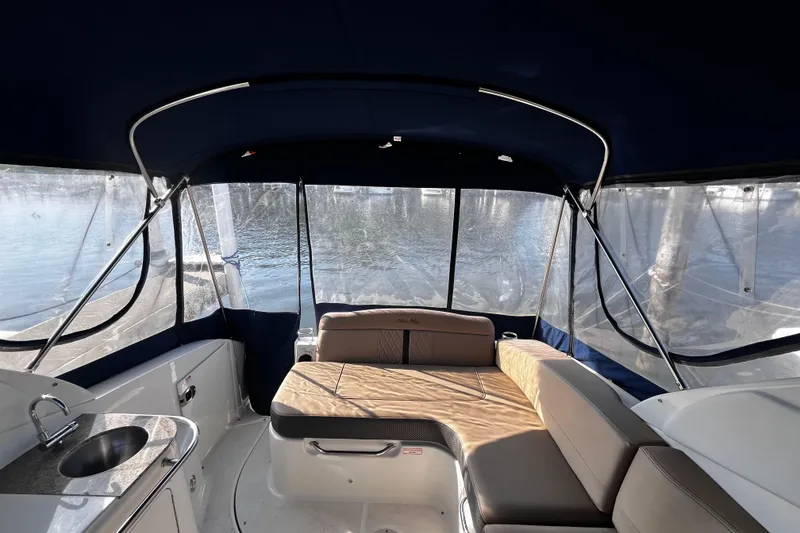 Slide: The Image of Interior of 2016 Sea Ray 280 Sundancer boat with seating and kitchenette. - 14