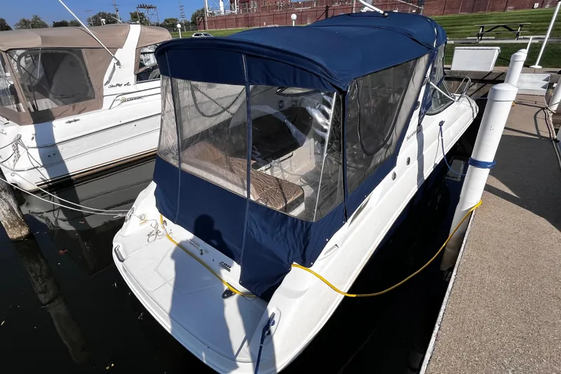Slide: The Image of 2016 Sea Ray 280 Sundancer docked with blue canopy cover. - 3