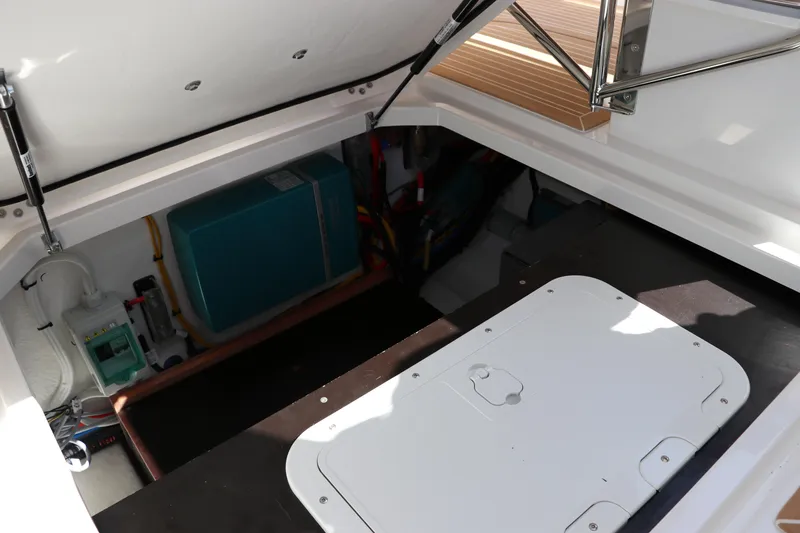 Slide: The Image of Open storage compartment in 2025 Nimbus T11 boat, showcasing interior equipment and components. - 25