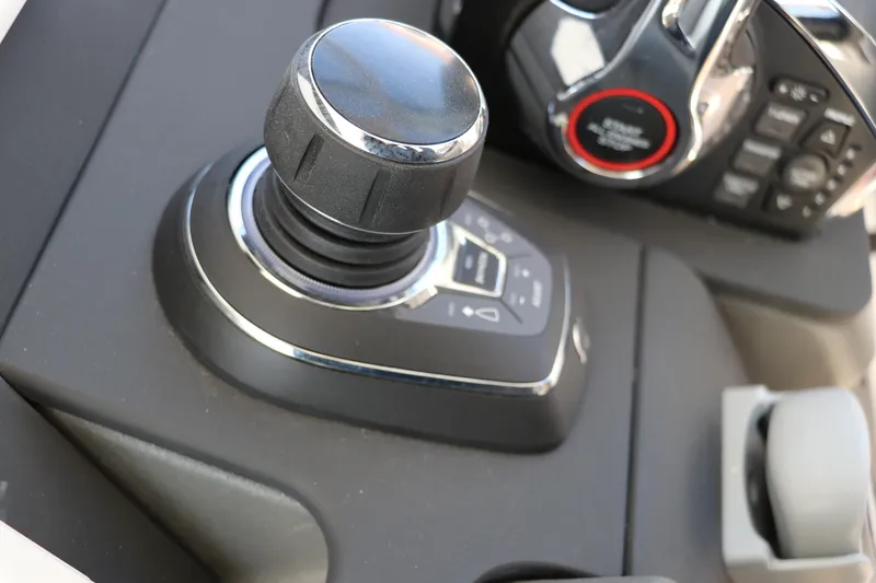 Slide: The Image of Control panel of 2025 Nimbus T11 boat featuring joystick and throttle controls. - 39