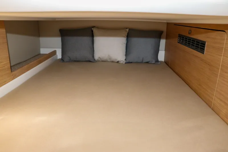 Slide: The Image of Cozy interior cabin of 2025 Nimbus T11 with cushions and wooden accents. - 50