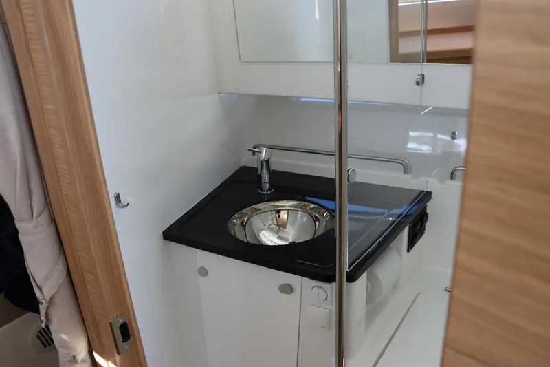 Slide: The Image of Modern bathroom interior in 2025 Nimbus T11 boat, featuring sleek sink and fixtures. - 53