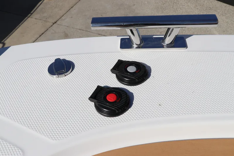 Slide: The Image of Deck of Nimbus T11 2025 boat with cleat and control dials. - 64