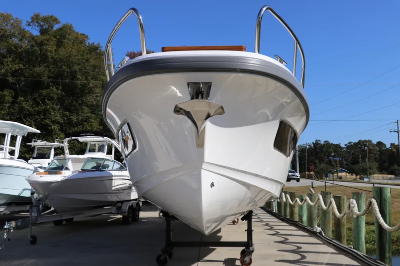 Slide: The Image of Front view of 2025 Nimbus T11 boat on trailer, outdoors. - 8