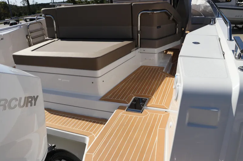 Slide: The Image of Wooden table on Nimbus T11 boat, 2025 model, with sleek chrome supports. - 13