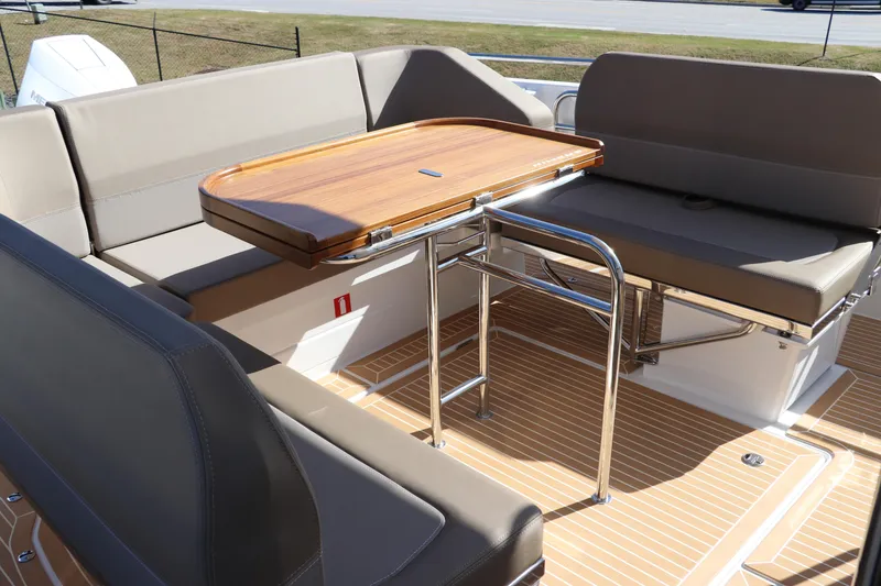 Slide: The Image of Stainless steel storage compartments on a 2025 Nimbus T11 boat deck. - 15
